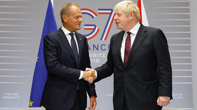 Donald Tusk y Boris Johnson